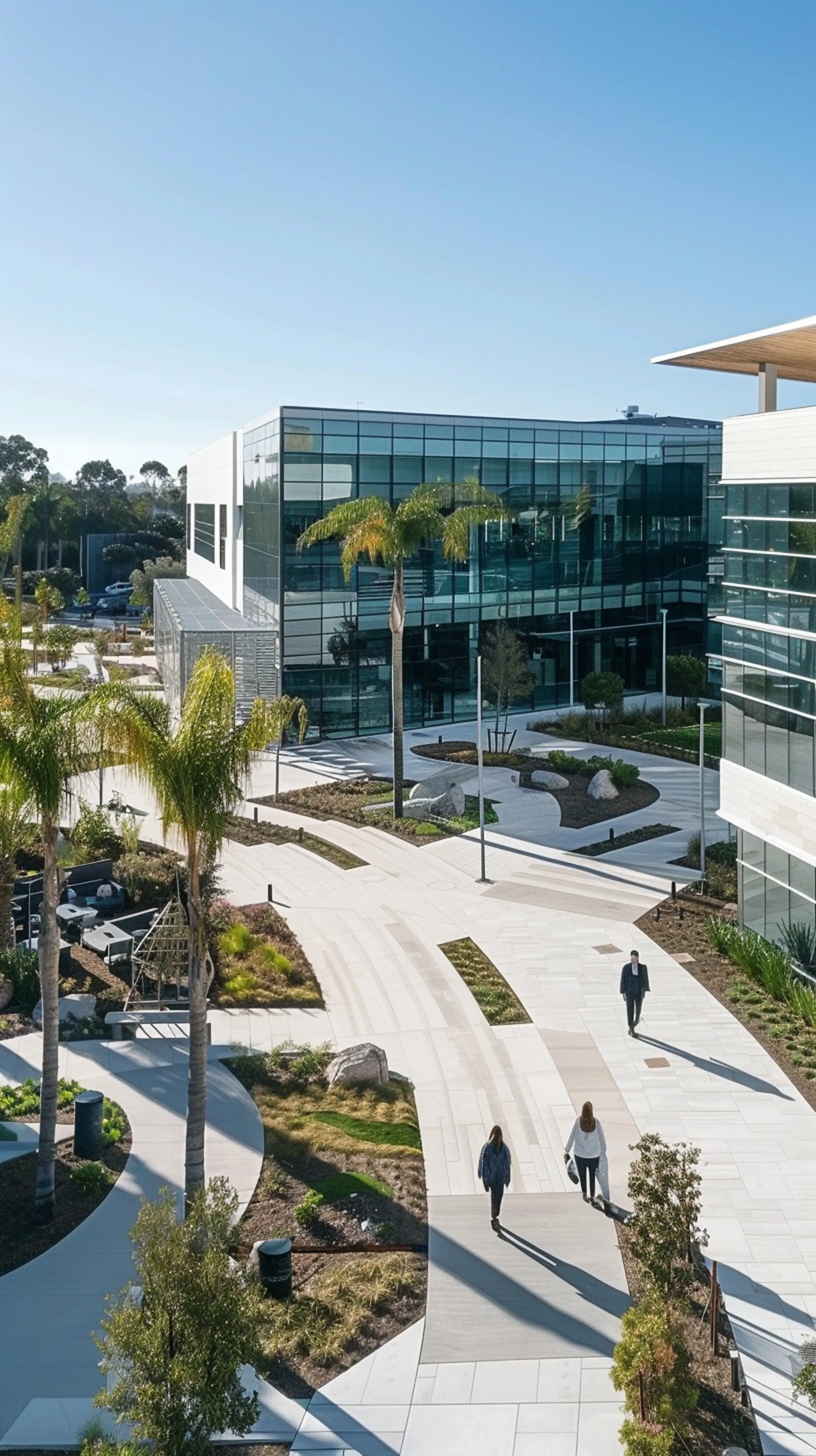 A photo of a newly built, renovated, and expanded corporate facility, seen in an outdoor exterior bird’s-eye view with modern architectural style, bright daytime lighting, and shot with a wide-angle lens.